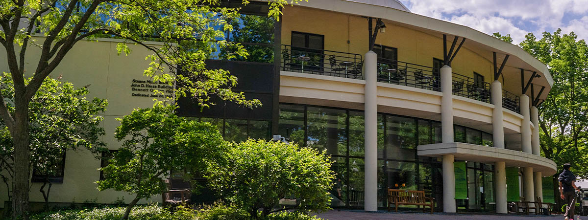 Exterior of Ravinia's John D. Harza Building, the home of the Steans Institute, with trees outside showing autumn colors